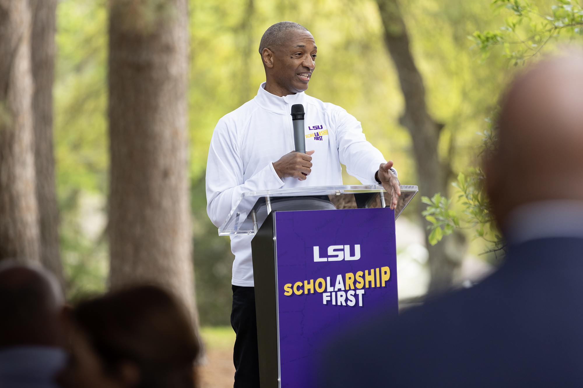 President Tate speaking at lectern