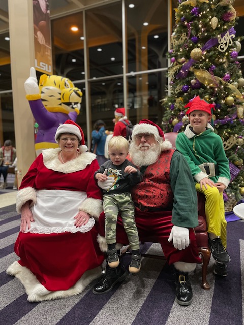 Santa Claus and Mrs. Claus with children