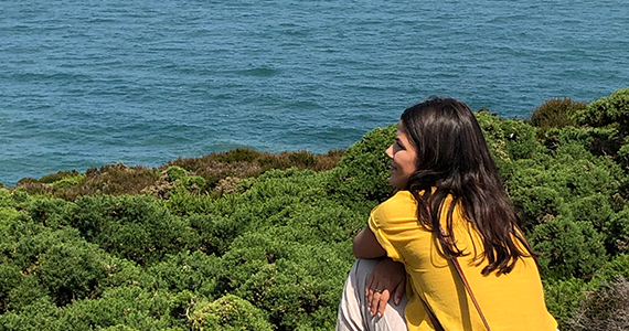 Girl looking out over ocean on a study abroad trip