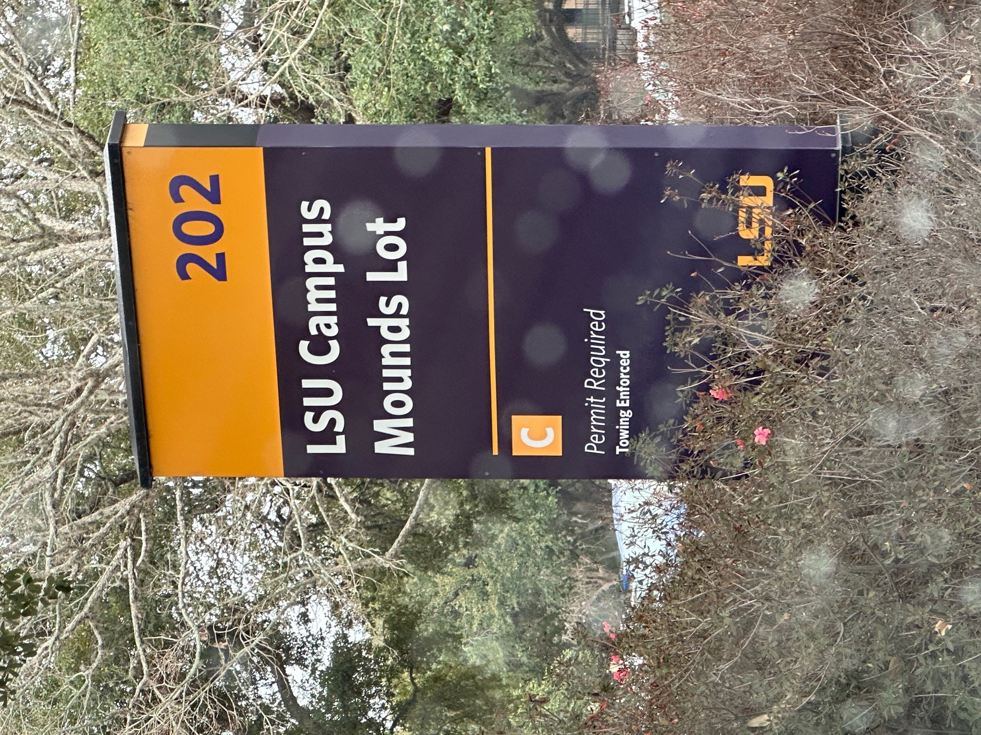 a parking lot sign near the LSU Campus Mounds reflects the updated name of the site