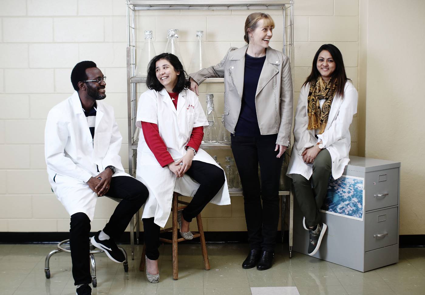 Research faculty engaging in a jovial discussion