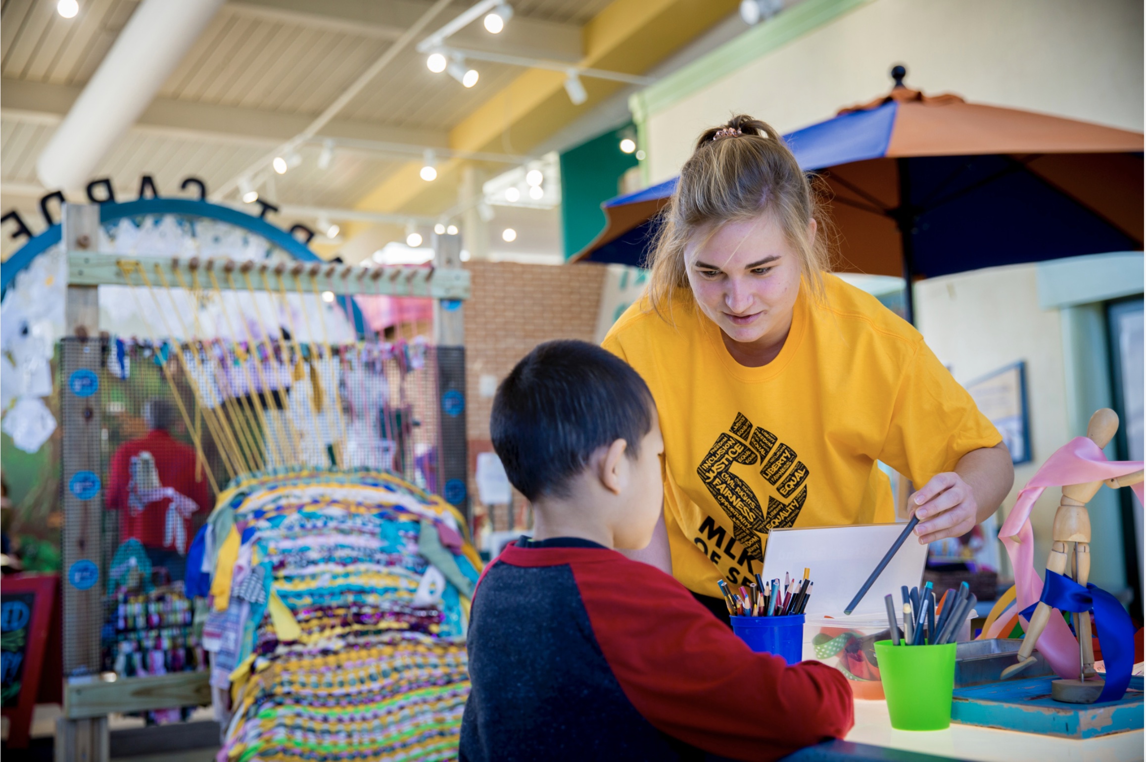 student volunteering at a school